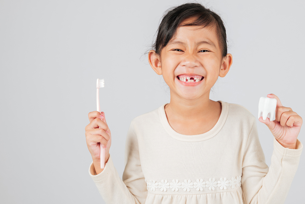 Kids dentist in Whitby monitoring tooth development milestones at Birch Dental